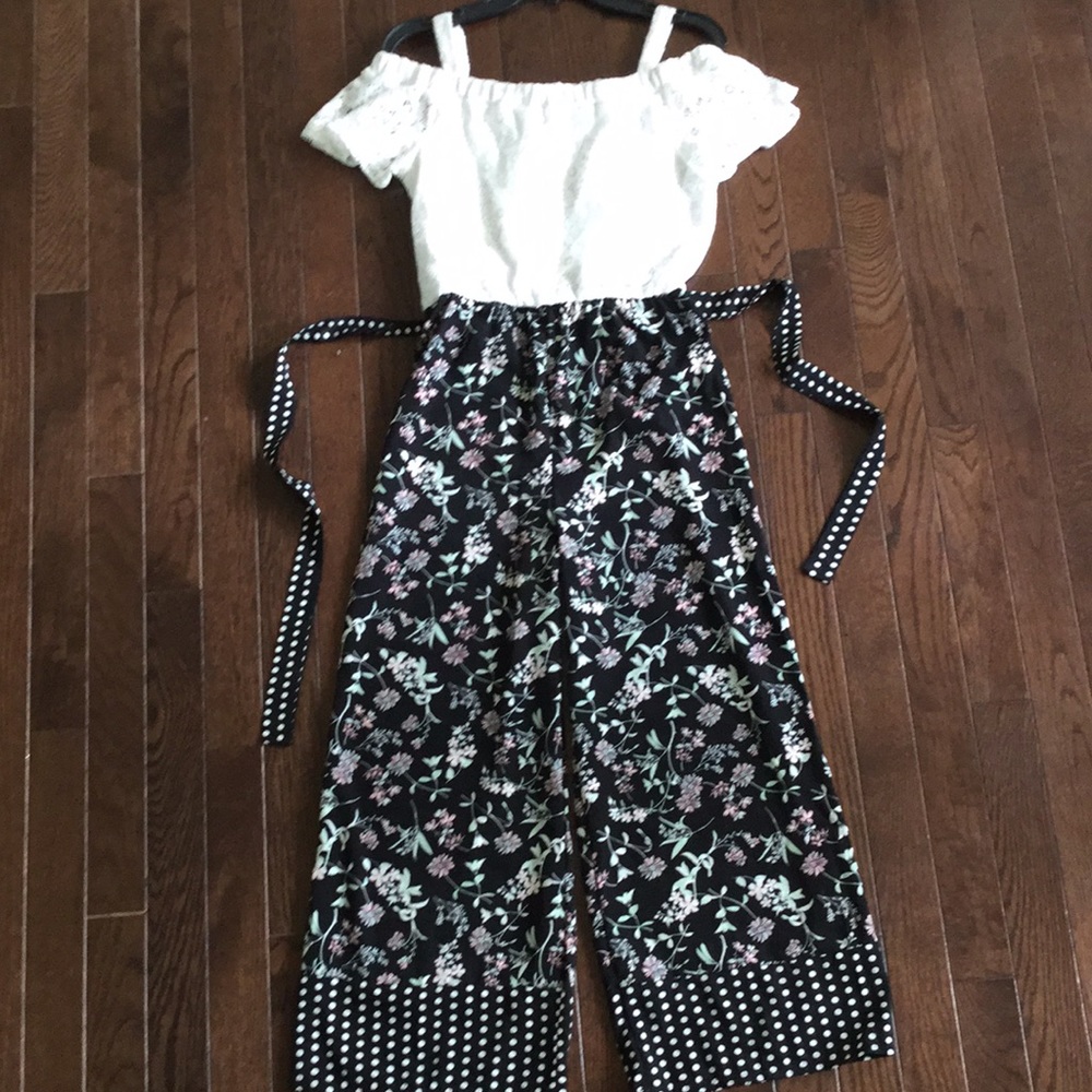 Floral pants with off the shoulder white top.